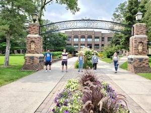 Students Underneath the BSU Arch